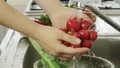 Woman washin vegetables