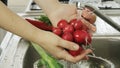 Woman washin vegetables