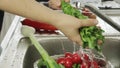 Woman washin vegetables