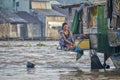 Woman washing clothes in Mekong river