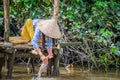 Woman washing clothes in the Mekong river Royalty Free Stock Photo