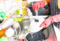 Woman washing dishes in the kitchen at home Royalty Free Stock Photo