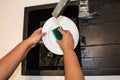 Woman washing dishes in the kitchen sink Royalty Free Stock Photo