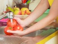 Woman washing fresh vegetables in kitchen Royalty Free Stock Photo