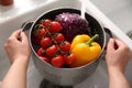 Woman washing fresh vegetables in kitchen sink, closeup Royalty Free Stock Photo