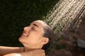 Woman washing hair in outdoor shower on summer day, closeup Royalty Free Stock Photo