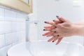 Woman washing hand prevents coronavirus spreading after back home