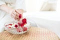 Woman washing hands with flower perfume in spa. woman holding essential water and fresh flowers Royalty Free Stock Photo