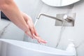 Woman washing hands with foam soap. Hygiene, preventing coronavirus