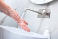 Woman washing hands with foam soap. Hygiene, preventing coronavirus