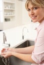 Woman Washing Hands At Kitchen Sink Royalty Free Stock Photo