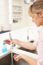 Woman Washing Hands At Kitchen Sink Royalty Free Stock Photo