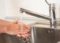 Woman washing hands under a tap water Royalty Free Stock Photo