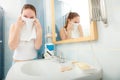 Woman washing her face with clean water in bathroom Royalty Free Stock Photo