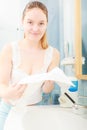 Woman washing her face with clean water in bathroom Royalty Free Stock Photo