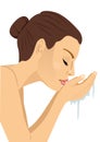 Woman washing her face