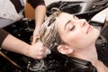 Woman washing her hair in hairsalon