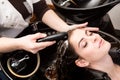 Woman washing her hair in hairsalon