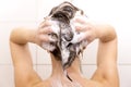 Woman washing her hair in shower Royalty Free Stock Photo