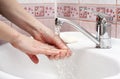 Woman washing her hands