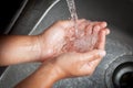 Woman washing her hands under running water Royalty Free Stock Photo