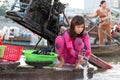 Woman washing laundry on boat Royalty Free Stock Photo