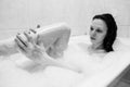 Woman washing leg in bath at home. Royalty Free Stock Photo
