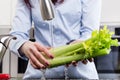 Woman washing vegetables in kitchen sink Royalty Free Stock Photo