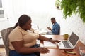 Woman watch on laptop while man use smartphone Royalty Free Stock Photo