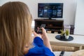 Woman watches Smart TV at home