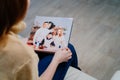 woman watches photobook from a family photo shoot