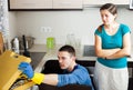 Woman watching as plumber working Royalty Free Stock Photo