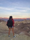 Woman watching beautiful sunrise from Zabriskie Point at Death Valley National Park in California USA Royalty Free Stock Photo