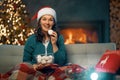 Woman watching holiday movies at home Royalty Free Stock Photo