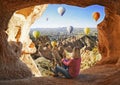 Woman watching like colorful hot air balloons flying over the valley at Cappadocia Royalty Free Stock Photo