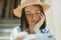 Woman watching an online movie on her phone