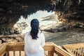 Woman watching Sea Lions through Admirals Arch lookout Royalty Free Stock Photo