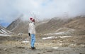 A woman watching the snow mountain in Ladakh, India