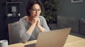 Woman watching something on laptop Royalty Free Stock Photo