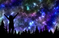 Woman watching the stars in night sky above the pine forest Royalty Free Stock Photo