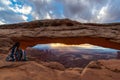 Woman watching the sunrise at Mesa Arch, Canyonlands National Park, Utah, USA Royalty Free Stock Photo