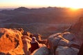 A woman watching the sunrise on the top of mountain Moses in Saint Catherine in Sinai Royalty Free Stock Photo