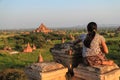 Woman watching the sunset in Bagan Myanmar