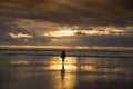 Woman watching sunset at the beach Royalty Free Stock Photo