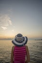 Woman watching sunset at sea Royalty Free Stock Photo