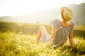 Woman watching the sunset. Serenity and relaxation.