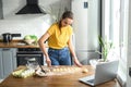 Woman watching video recipes and preparing food Royalty Free Stock Photo