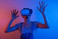 Woman watching with VR with red and blue light