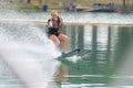 Woman water skiing one handed Royalty Free Stock Photo