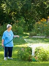 Woman watering flowers